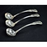 A set of three George IV hallmarked silver ladles with shell finials,