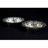 A pair of Victorian hallmarked silver repoussé decorated bonbon dishes, Sheffield 1894,