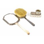 A hallmarked silver engine turned hand mirror and brush,