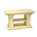 A stone-effect occasional table with rectangular top on twin column supports with single shelf and