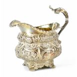 A George IV hallmarked silver jug, Naphthal Hall, London 1823,