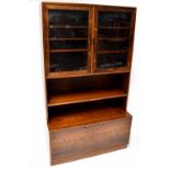 A Danish mid-20th century rosewood display cabinet with glazed top over open shelves,