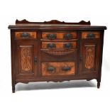 An Art Nouveau mahogany bow-fronted sideboard with gallery back and five walnut veneered drawers