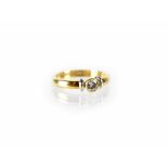An 18ct yellow gold collet set diamond solitaire ring, size K, approx 4.2g.