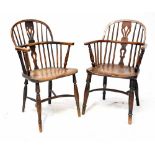 A 19th century elm seated Windsor stick-back armchair with pierced splat,
