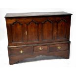 A Georgian oak Lancashire chest with single door over three drawers,