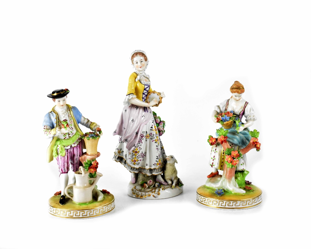 Two 19th century Dresden porcelain figures, one depicting a girl picking flowers,