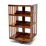 An Edwardian mahogany revolving bookcase with square top and three tiers,