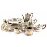 A quantity of plated ware to include a large oval tray, circular footed tray, swing handle basket,