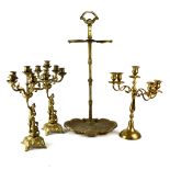 A gilt metal umbrella stand with shaped and shell motif base,