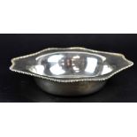 An Edward VII hallmarked silver bowl of shaped circular form with bead rim, diameter 24cm,
