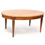 A reproduction inlaid oval coffee table to tapering fluted supports and peg feet, length 99cm.