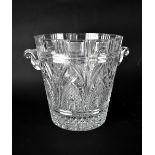 A cut glass ice bucket with twin handles with pineapple cut and arched decoration, height 25.