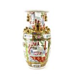 A 20th century Chinese Famille Rose vase of baluster form with applied gilt dragons and Dogs of Fo,