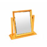 A modern light oak swing toilet mirror of rectangular form with bevelled glass,