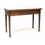 A good 19th century mahogany tea table of rectangular form with fold-over top and carved frieze