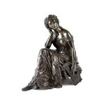 A 19th century bronze figure of a seated Grecian female with laurel leaf headdress and Greek Key