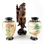 A pair of Japanese Satsuma vases of baluster form decorated with scenes of Mount Fuji and scenes of