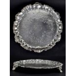 A Victorian hallmarked silver salver with shell and scroll rim, central armorial engraving,