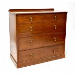 A 19th century mahogany chest of two short over three long graduated drawers with brass pear drop
