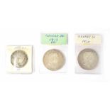 Three George III silver coins to include two silver crowns dated 1819 and 1820 and a silver half