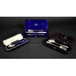 Three cased hallmarked silver Christening sets, one three-piece comprising knife, fork and spoon,