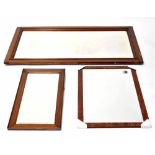 Three various wooden-framed rectangular bevelled glass mirrors, widths 126cm, 76cm and 70cm (3).