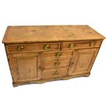 A late George III Lincolnshire pine dresser, with moulded top above two drawers, three further