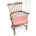 A 19th century elm seated spindle back armchair on column supports.Additional InformationNumerous