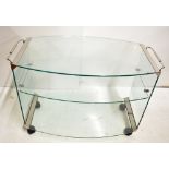 A contemporary glass dinner wagon/tea trolley.