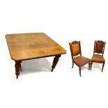 A Victorian oak extending dining table, the rectangular top with canted corners, two additional