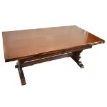 An oak dining suite comprising a large reproduction draw leaf refectory table with cut end