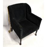 An Edwardian child's wing back armchair, height 56cm, width 40cm, depth 44cm.Additional