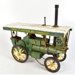 A model steam engine painted in white and green with motto 'Mighty in Strength and Endurance