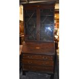 An Edwardian inlaid mahogany bureau bookcase, with pair of astragal doors above fall front and three