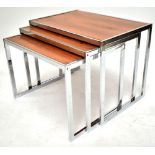 RICHARD YOUNG FOR MERROW ASSOCIATES; a nest of chrome framed rosewood coffee tables, dimensions of