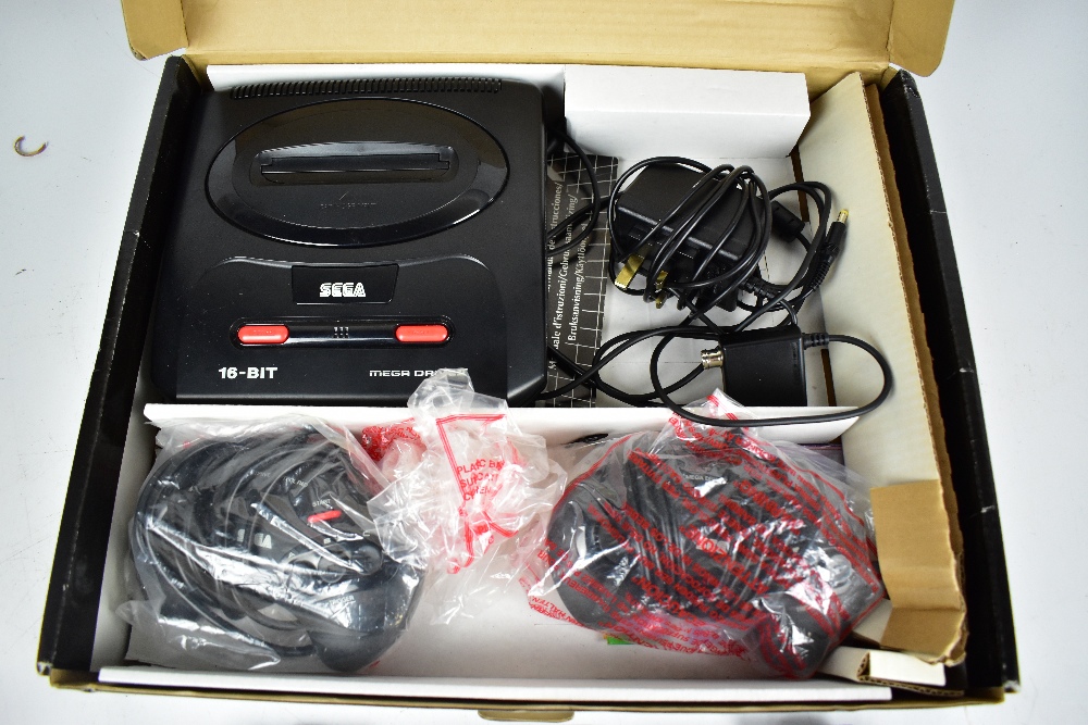 SEGA; a boxed Megadrive II with two controllers, RF and power units, also six games comprising ' - Image 2 of 4