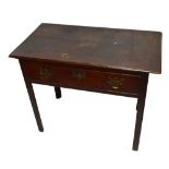 An 18th century oak side table with single frieze drawer on square chamfered supports, height