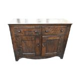 A 19th century oak sideboard with two drawers above pair of panel doors, width 124cm.