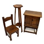 A small reproduction oak side cabinet with pair of Gothic-style doors, length 51cm, depth 32.5cm,