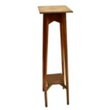 An Arts & Crafts oak plant stand with square section top and under-tier, height 117cm, top 30 x