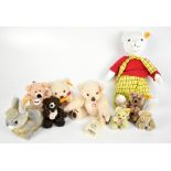 STEIFF; a Rupert Bear in classic outfit, seven small and miniature sized bears and a rabbit, all