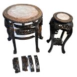 An early 20th century Chinese carved rosewood marble topped jardinière stand, with carved and