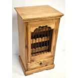 A reproduction wine cabinet, the single door enclosing fixed shelf above base drawer, height 98cm.