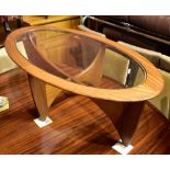 G-PLAN; a teak oval coffee table with glass top, height 42cm, length 122cm, width 66cm.