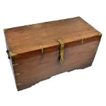 An Indian brass mounted teak blanket box with twin carrying handles, the hinged lid enclosing two