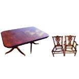 A reproduction mahogany dining room suite comprising twin pedestal table raised on outswept supports
