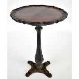 An iron framed tilt top tripod table with later ebonised top, height 49cm.Additional