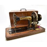 FRISTER & ROSSMAN OF BERLIN; a late 19th/early 20th century tabletop sewing machine with gilt