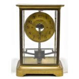 BULLE; an early brass cased electric clock, the circular dial set with Arabic numerals and